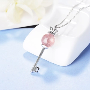 Romantic crown key necklace featuring pink strawberry quartz pendant and sparkling zircons
