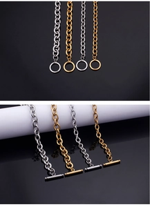 Detailed view of stainless steel OT buckle necklaces in gold and silver finishes