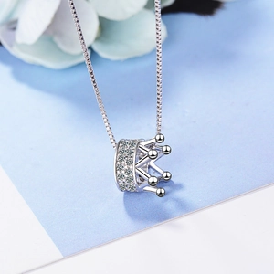 Elegant silver crown necklace with cubic zirconia pendant on classic box chain