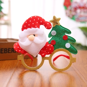 Detail of Christmas glasses featuring a Santa hat, sequined tree, and gold glitter frame
