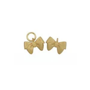 Macro shot of matte gold bow-shaped S925 silver jewelry charm with round jump ring detail