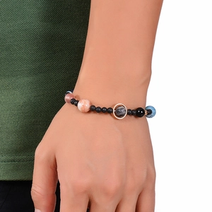 Solar System planetary bracelet featuring colorful natural stones on a model's wrist