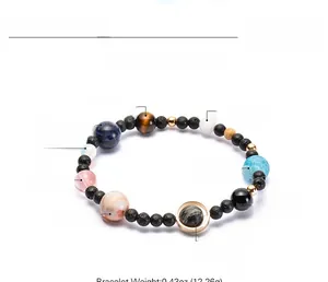 Detail of natural stone solar system bracelet with planetary beads and size markers