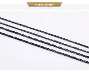 Detailed macro view of four different widths of black stainless steel box chains for jewelry