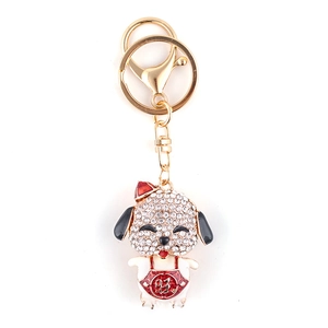 Cartoon zodiac dog keychain with rhinestones and lucky Chinese character on white background