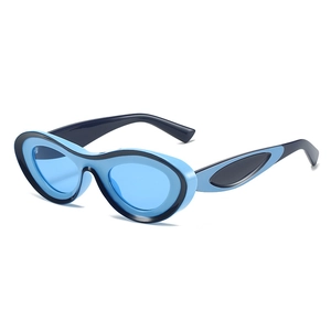 Trendsetting cat-eye sunglasses with bold blue color blocking and avant-garde frame design