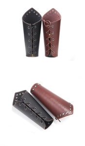 Detail view of black and brown faux leather arm guards with metal eyelets and rivets