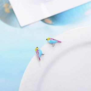 Sweet colorful bird stud earrings in blue and pink glaze finish on white porcelain