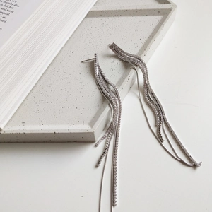 925 Sterling silver tassel earrings with sparkling cubic zirconia on grey textured tray