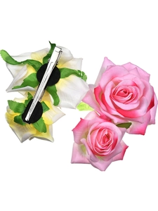 Detail showing the metal clip back and fabric rose petals of the floral hair accessory