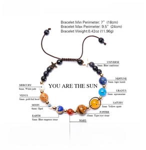 Detail view of solar system bracelet with labeled natural stone beads for each planet