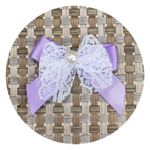 Handmade purple satin bow with white lace trim and pearl center for DIY crafts