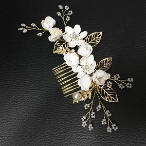 Pink and blue bridal hair comb set with ceramic flowers and pearls on golden metal
