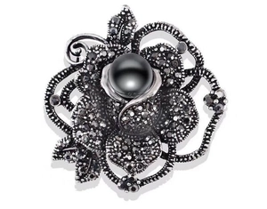 Vintage gunmetal rose brooch with black pearl and crystal rhinestones on white background