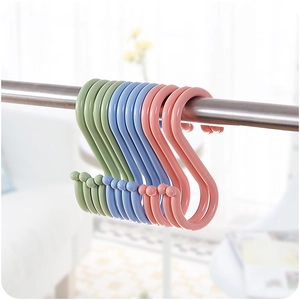 Multicolor S-shaped plastic hooks for kitchen and bathroom hanging on a metal rod