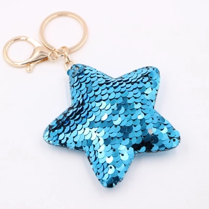 Blue sequin star keychain with golden metal ring on a clean white background
