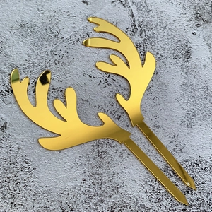 Golden acrylic reindeer antler cake toppers with mirror finish for Christmas decor