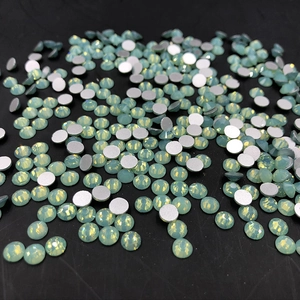 Macro view of light green opal AB rhinestones with flat back design for nail art