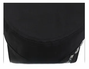 Detail of the stitching and metal star rivet on a black canvas flat top army cap