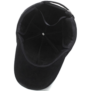 Interior view of black corduroy baseball cap showing reinforced seams and buckle strap