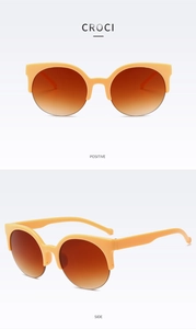 Front and side views of vintage cat eye sunglasses with cream frames and brown gradient lenses