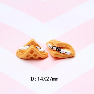 Detail view of miniature resin waffle craft charms with cream and chocolate sauce