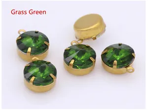 Macro view of grass green crystal stones with gold claw settings for jewelry DIY