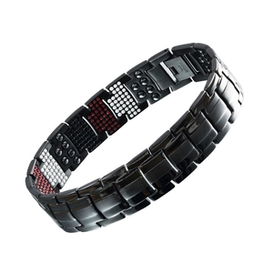 Macro shot of 15mm black stainless steel bracelet with magnetic stones and engraved clasp