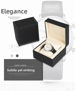 Close-up of black leather watch box with white stitching and luxury quartz watch
