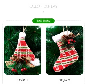 Detail of knit Christmas hat and stocking ornaments with pine cones and burlap bows