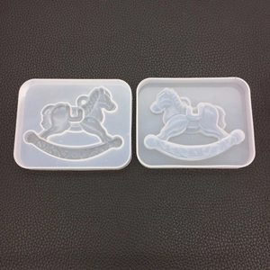 Detail showing two flexible rocking horse silicone molds for DIY resin casting projects