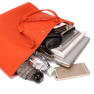 Large capacity orange tote bag showing interior storage for laptop, tablet and umbrella