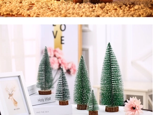 Miniature pine trees with faux snow on natural wood base for festive table decoration