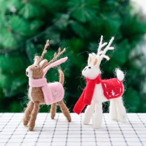 Handmade wool felt Christmas reindeer figurines with snowflake embroidery for holiday decor