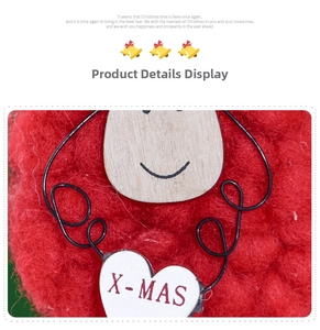 Detail of red wool felt Christmas ornament with heart-shaped X-MAS tag and wooden face