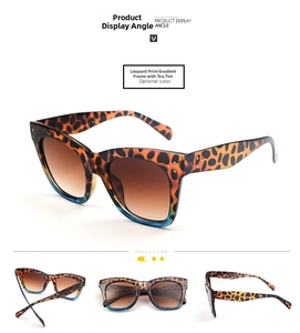 Detail view of leopard gradient cat-eye sunglasses with rivets and brown tinted lenses