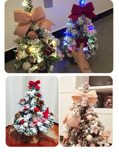 Mini Christmas tree detail with pink bow, felt dolls, and LED lights decoration