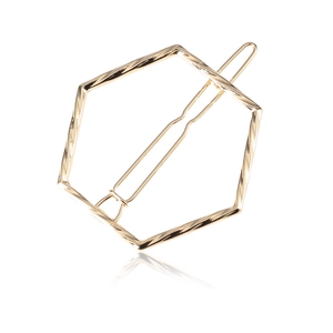 Minimalist gold geometric hexagonal hair clip with twisted metallic texture for women