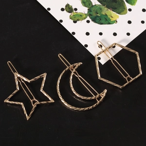 Golden 3-piece hair clip set with twisted moon, star and hexagon geometric designs