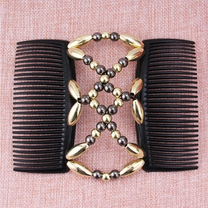 Detail view of a double-row magic hair comb with gold and dark metallic beaded strings