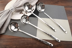 Polished stainless steel soup and slotted spoons set with leaf pattern engraving