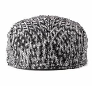 Classic grey herringbone flat cap for men with premium british vintage tweed texture