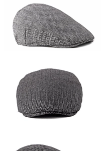 Detail view of black and gray herringbone ivy cap showing rich wool fabric texture