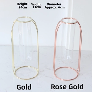 Detail view of 24cm gold and rose gold metal test tube vases with precise dimensions