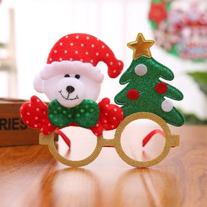 Detail of Christmas glasses featuring a cute white bear with a red hat and a glittery tree