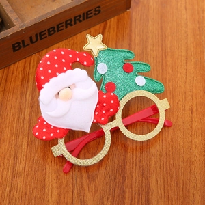 Christmas party glasses with glitter gold frames and festive Santa and tree decorations
