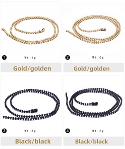 Detail view of golden and black stainless steel ball chains in 4g and 6g weights