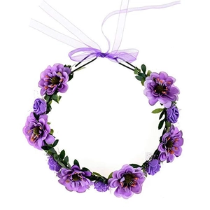 Detailed view of purple floral crown featuring silk flowers and adjustable ribbon