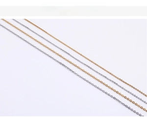Close-up of thin O-shaped stainless steel chain necklaces in gold and silver finishes