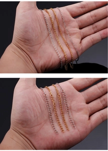 Detail of silver and gold stainless steel O-shaped necklaces with extension chains